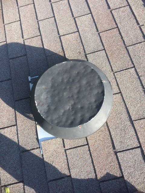 White metal roof section with turbine vent — Heritage Roofing metal roofing Texas