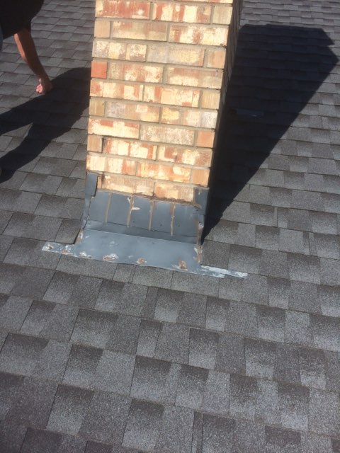 Residential composition shingle roof with chimney flashing detail — Heritage Roofing Stephenville TX