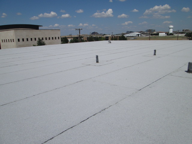 Modified bitumen flat roof on large commercial building — Heritage Roofing Stephenville TX