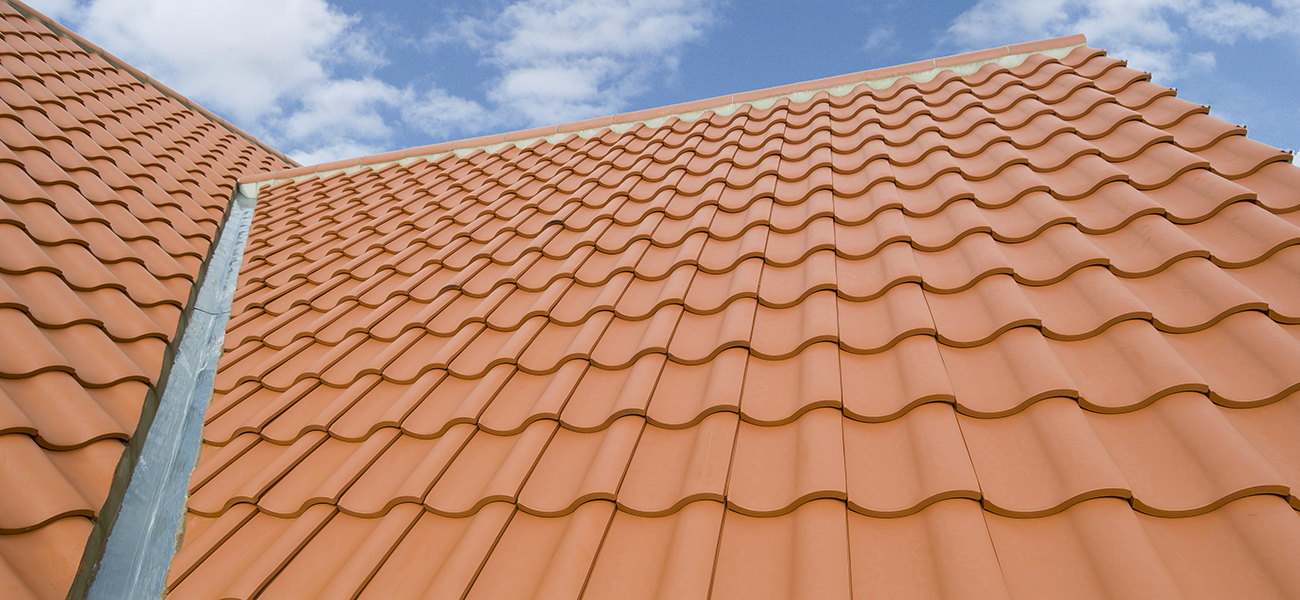 Terra cotta clay barrel tile roof — durable residential roofing option